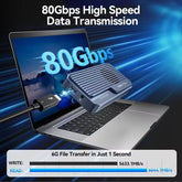 Laptop with external hard drive connected, showcasing 80Gbps high-speed data transmission.