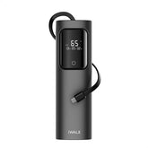 Black power bank with digital display and USB cable on a white background